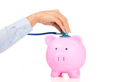 Woman hand stethoscope pink piggy bank Isolated on white background. Health care cost. Financial state condition self assessment concept. Financial system checkup, savings for medical insurance costs